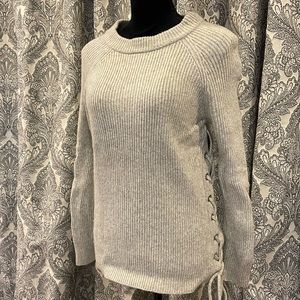 Gray crewneck sweater with lace up detail